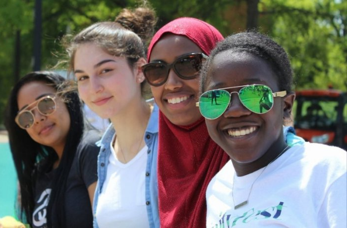 four women look at camera